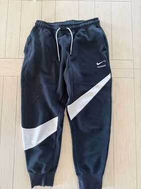 Nike  Black Sweatpants with White Swoosh Panels